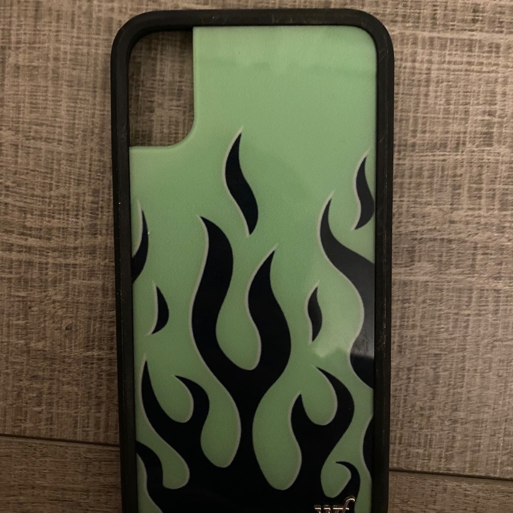 Green case with black flames